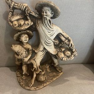 Vintage Chinese fisherman and boy. Resin figurine which imitates ivory.